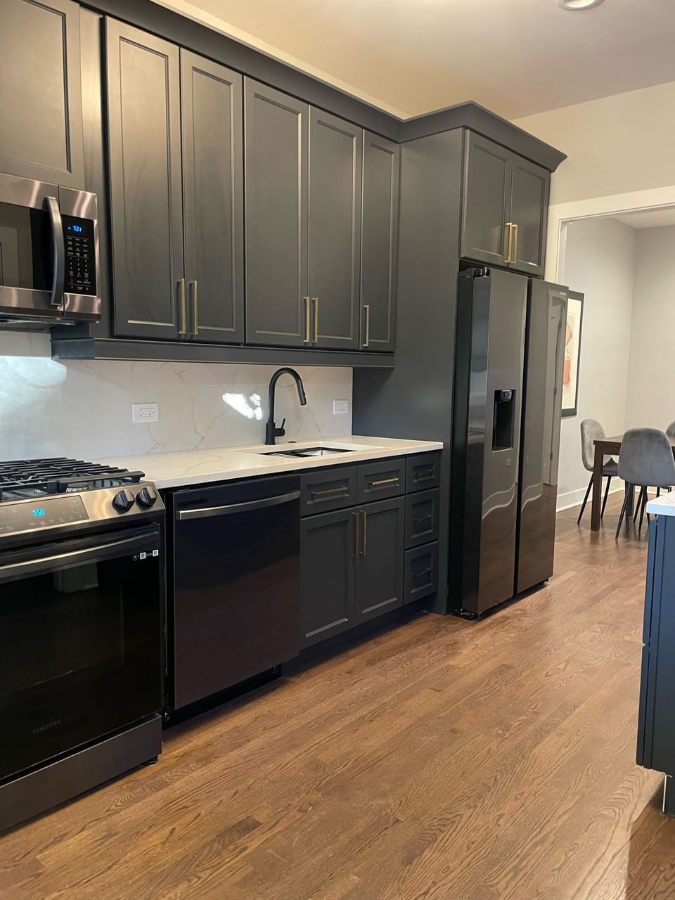5 burner stove, dishwasher, microwave and a refrigerator with ice/water maker.  