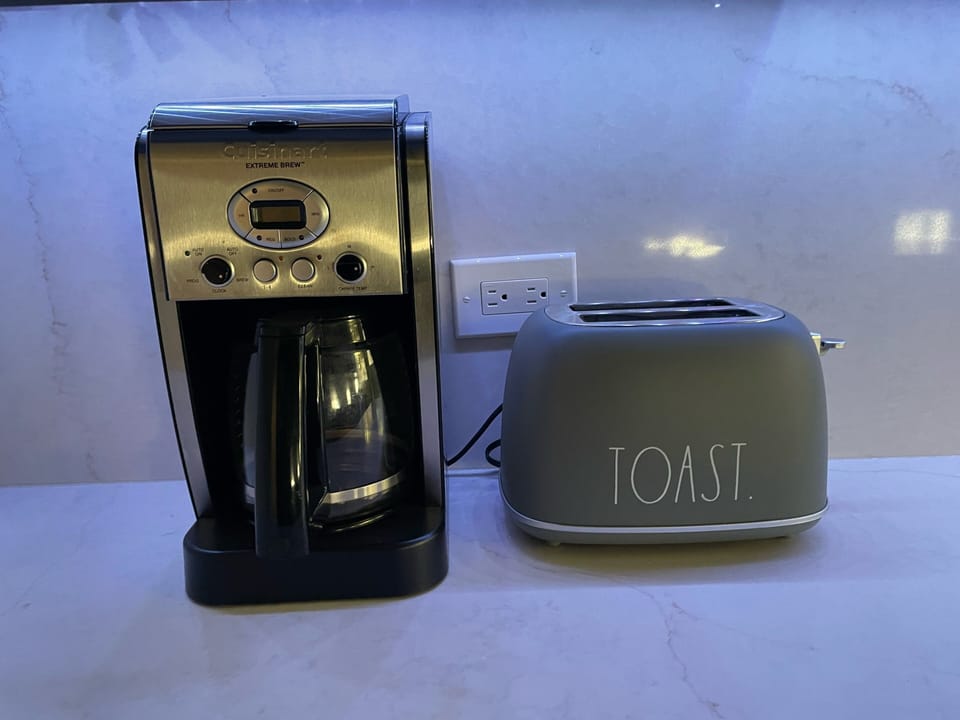 Coffee maker, coffee, sugar, toaster, salt and pepper and oil are supplied.