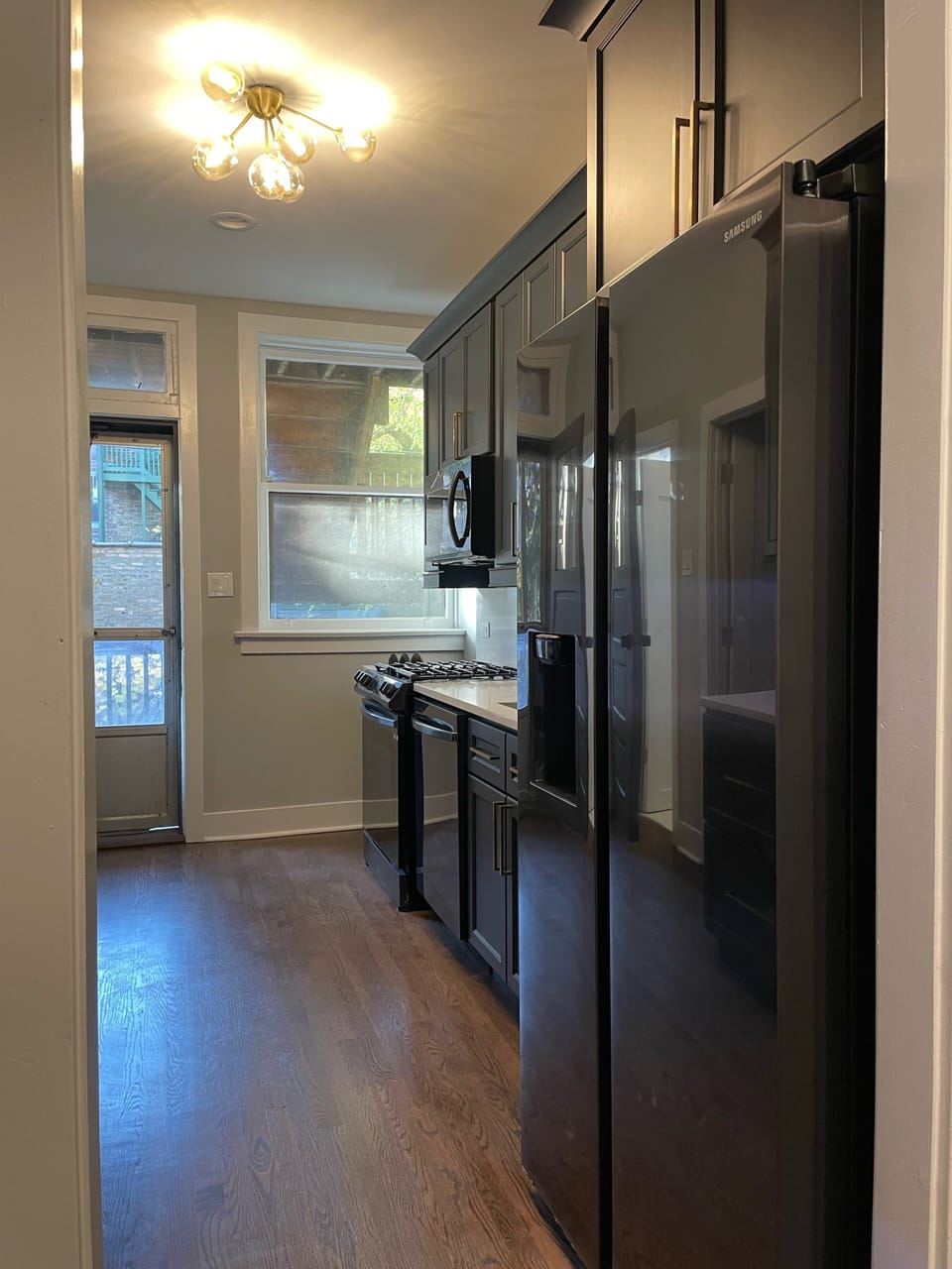New kitchen has upgraded appliances, new cabinetry and quartz ctops.