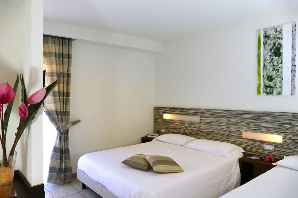 Standard Triple Room | Minibar, in-room safe, blackout drapes, cribs/infant beds