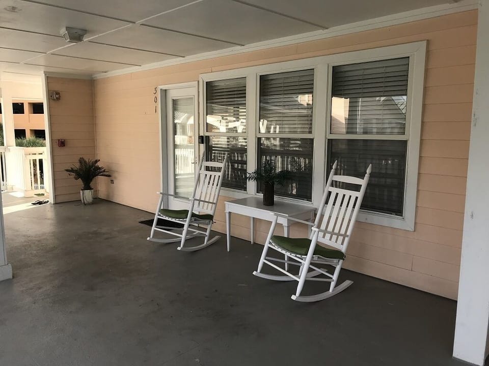 Front porch overlooks pool