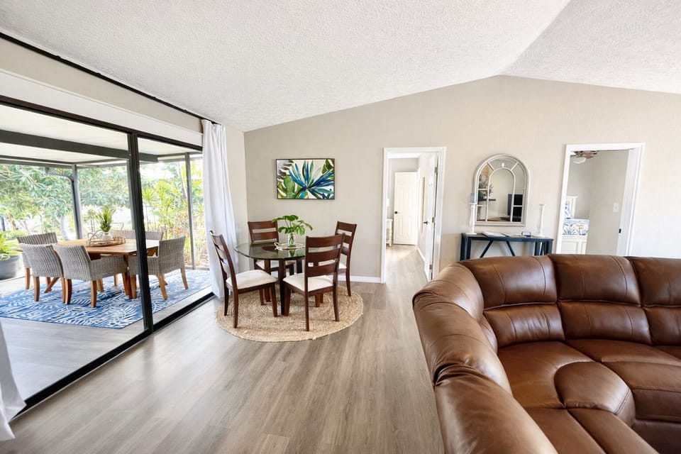 Bright open living and dining space with indoor-outdoor flow
