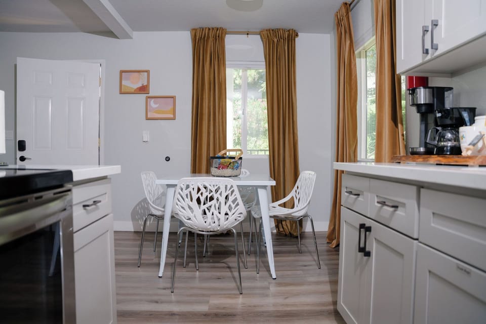 view of dining area, front entrance door, from kitchen