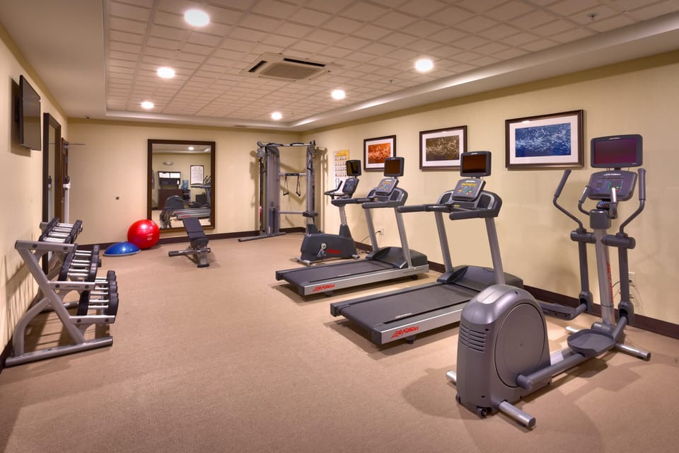 Fitness center with treadmills and exercise equipment.