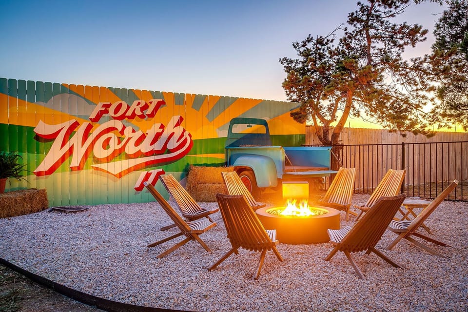 Gather under the stars beside the Fort Worth mural and firepit — connection, laughter, and city pride all in one scene.