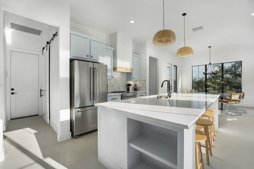spacious kitchen filled with neutral accents and natural light