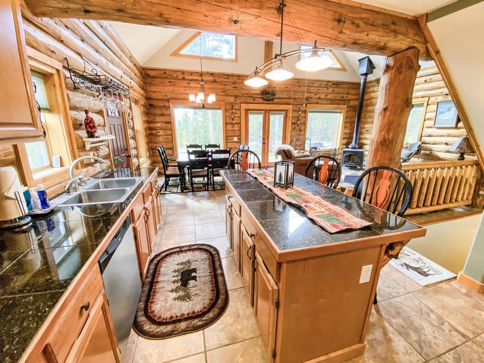 As you enter the upper level of the home, you are greeted by the large windows of the Great Room
