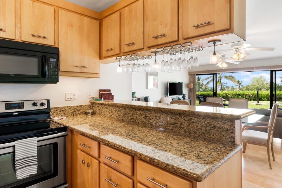Enjoy this view of Hawaii while you cook. Well-equipped kitchen with modern updates, full-size appliances, and everything needed for effortless meal prep during your stay.