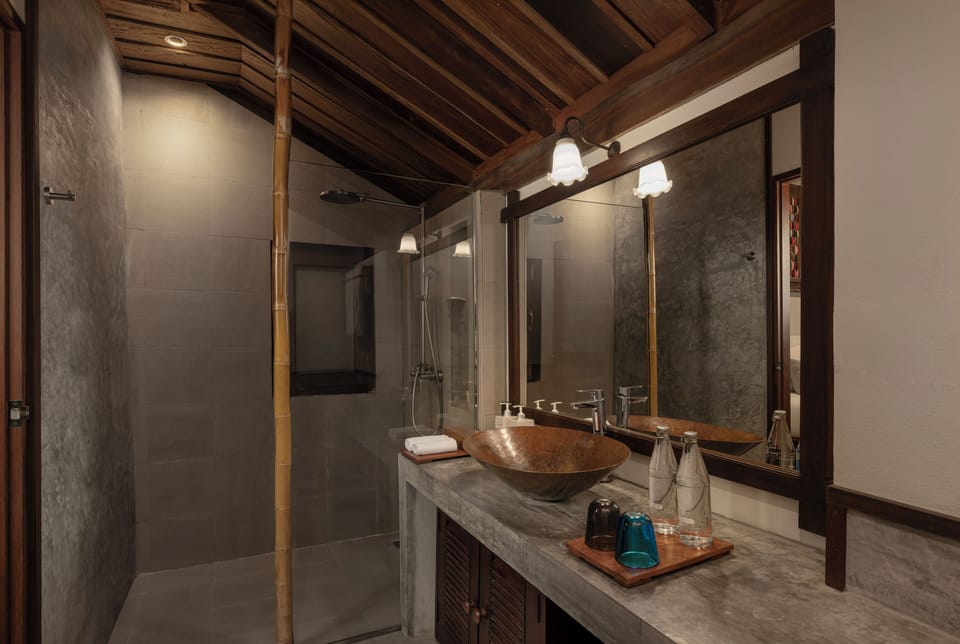 Overwater Bungalow | Bathroom | Separate tub and shower, rainfall showerhead, free toiletries