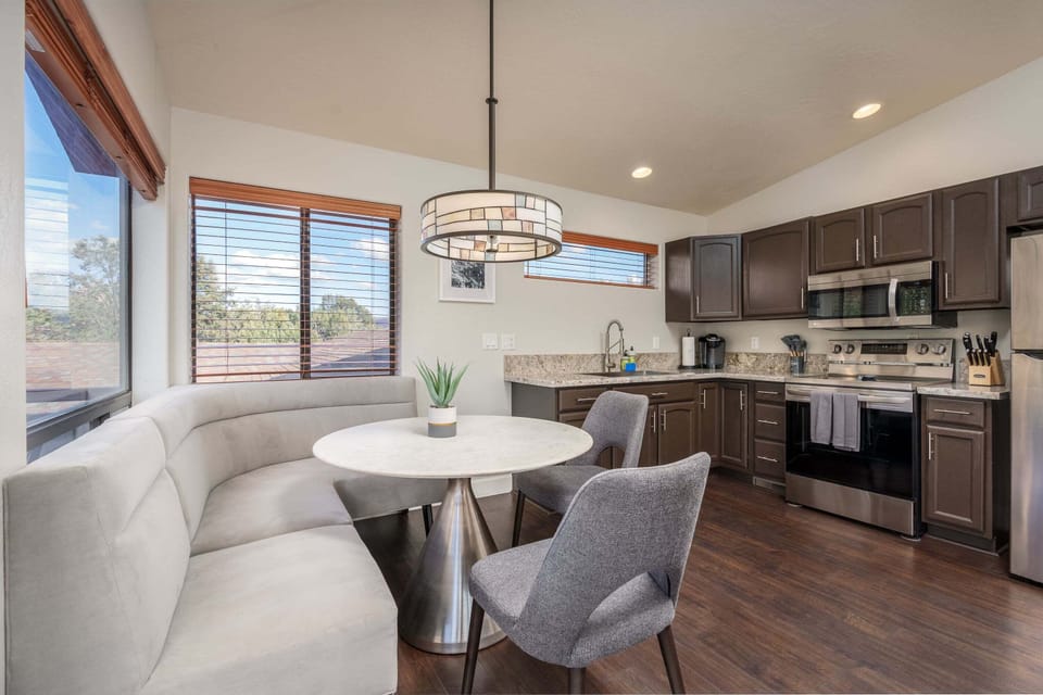 A stylish dining nook and fully equipped kitchen make mornings effortless.