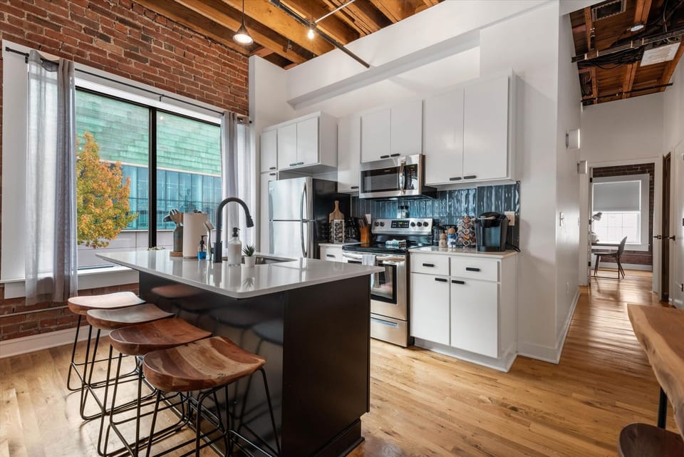 Cook and gather in a modern kitchen with island seating in Downtown KC