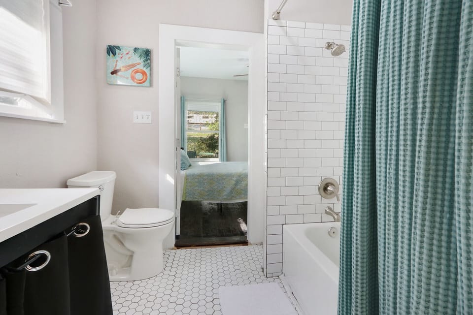 Bathroom two features a shower bath combo