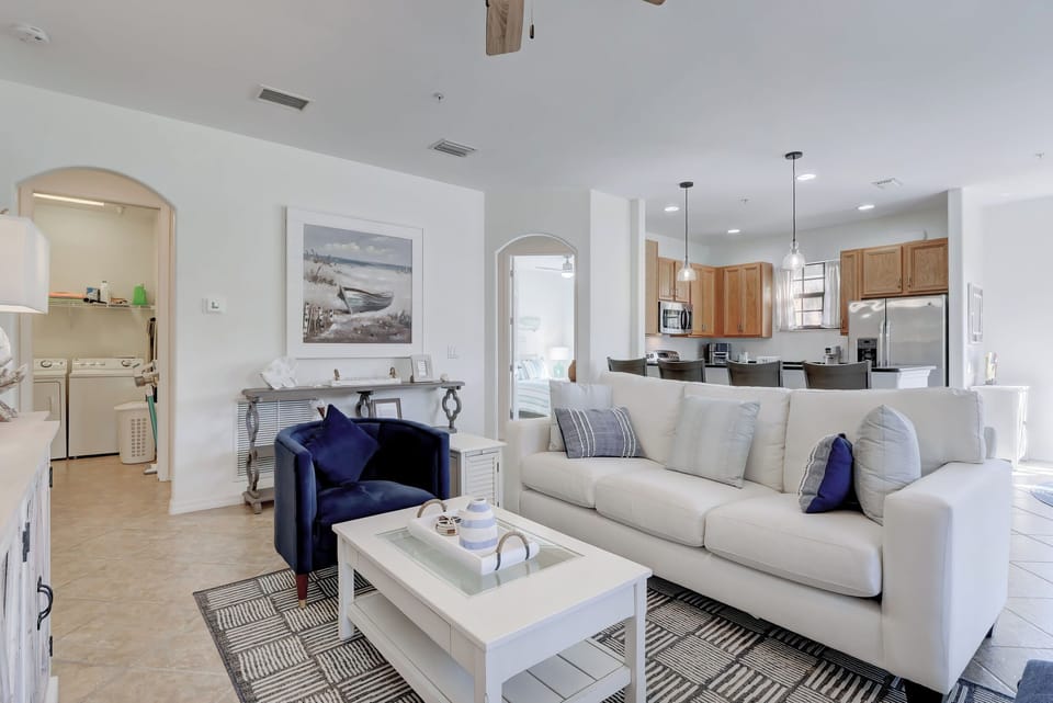 Looking From the TV in the Family Room Towards the Kitchen With Laundry and Garage to the Left
