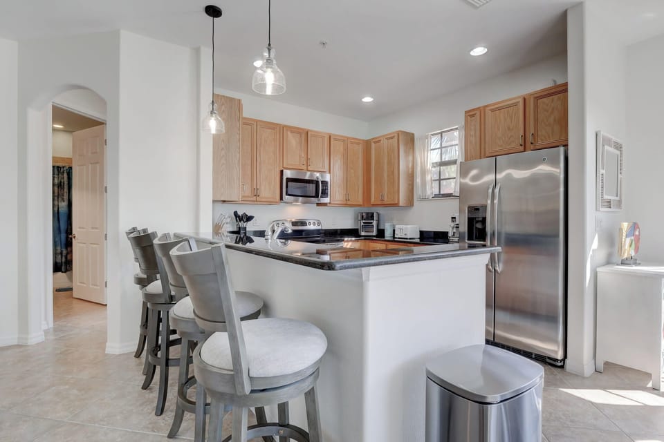 Guests Can Enjoy Informal Meals At the Bar Height Counter In the Kitchen