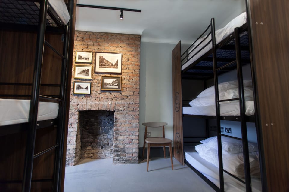 Bed in 9-Bed Mixed Dormitory Room with Shared Bathroom | Blackout drapes, iron/ironing board, free WiFi, bed sheets