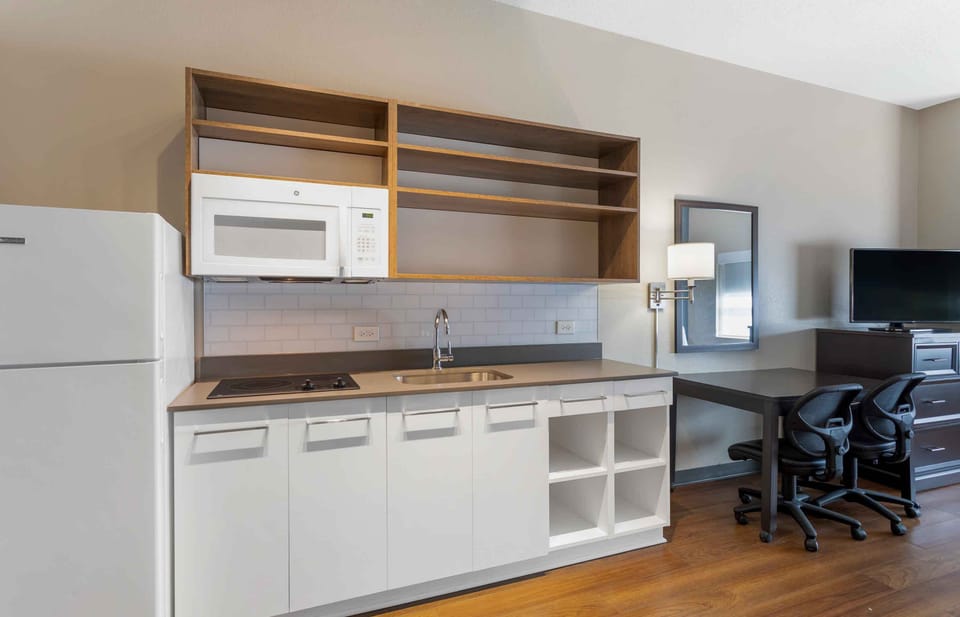 Studio, 1 King Bed, Non Smoking | Private kitchen | Coffee/tea maker, full-size fridge, microwave, stovetop