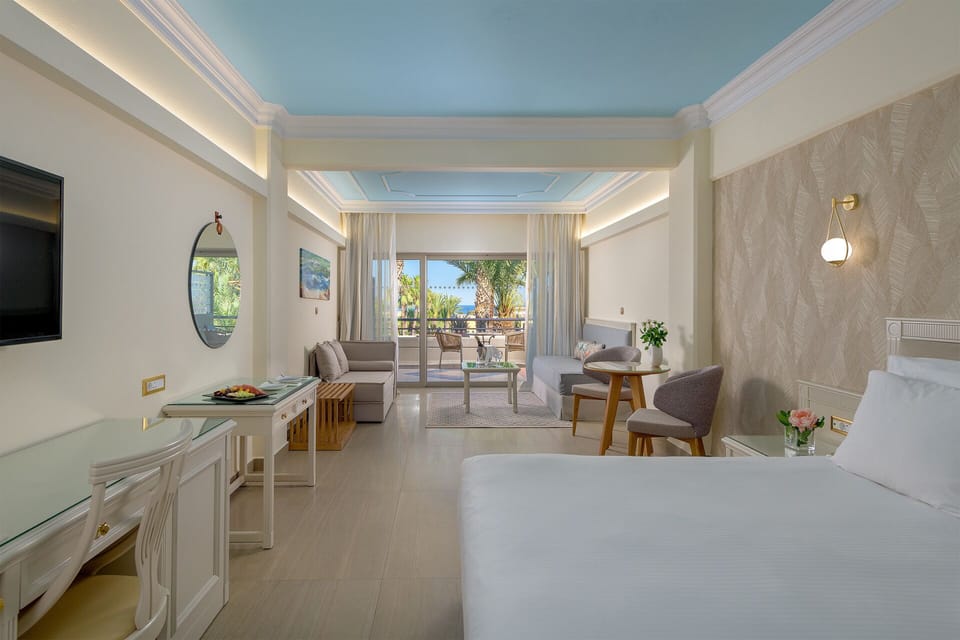 Junior Suite, Sea View | Minibar, in-room safe, free cribs/infant beds, free WiFi