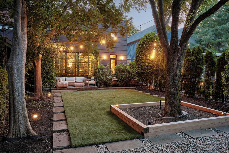 Game on: enjoy a fully turfed, private backyard designed for yard/lawn games.