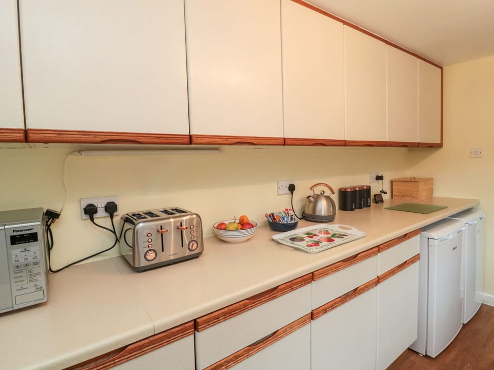 Fridge, electric kettle, toaster, cookware/dishes/utensils
