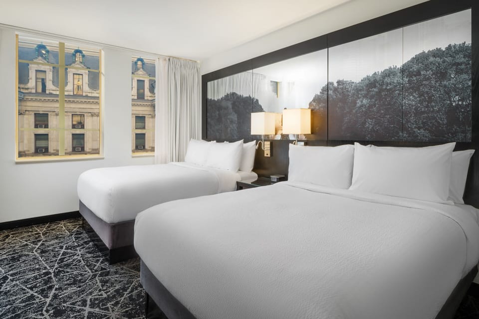 Premium bedding, desk, laptop workspace, iron/ironing board
