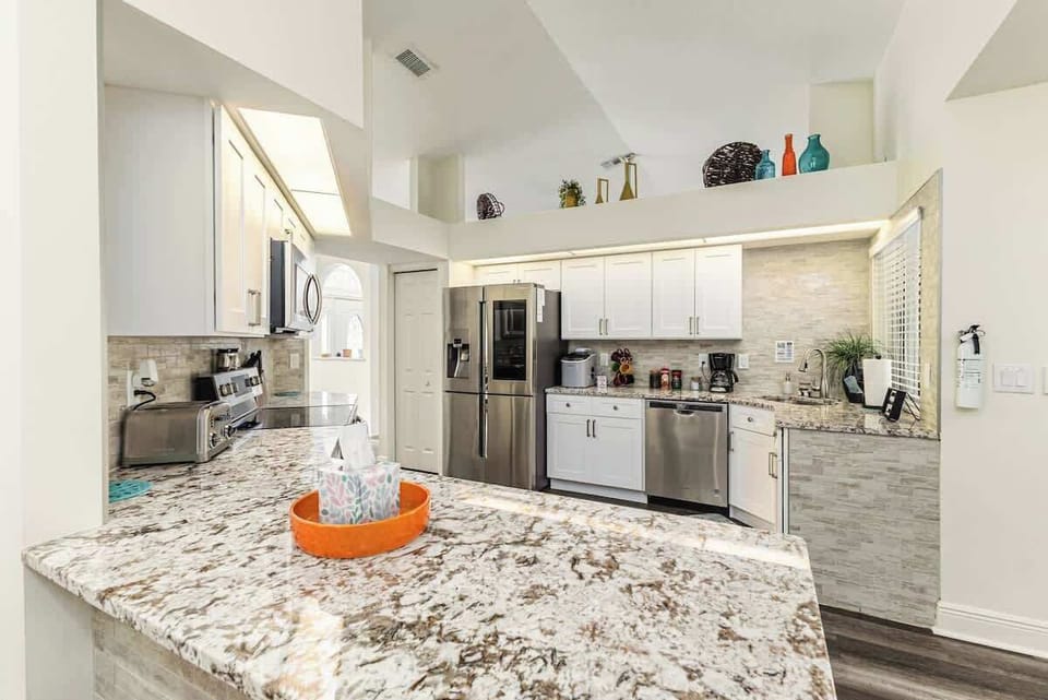 You can’t miss with this fully equipped kitchen. Gleaming granite countertops, a French door refrigerator, stainless steel 4-burner stove with dual oven, dishwasher, coffee maker, and toaster await. It’s perfect for all your culinary needs.