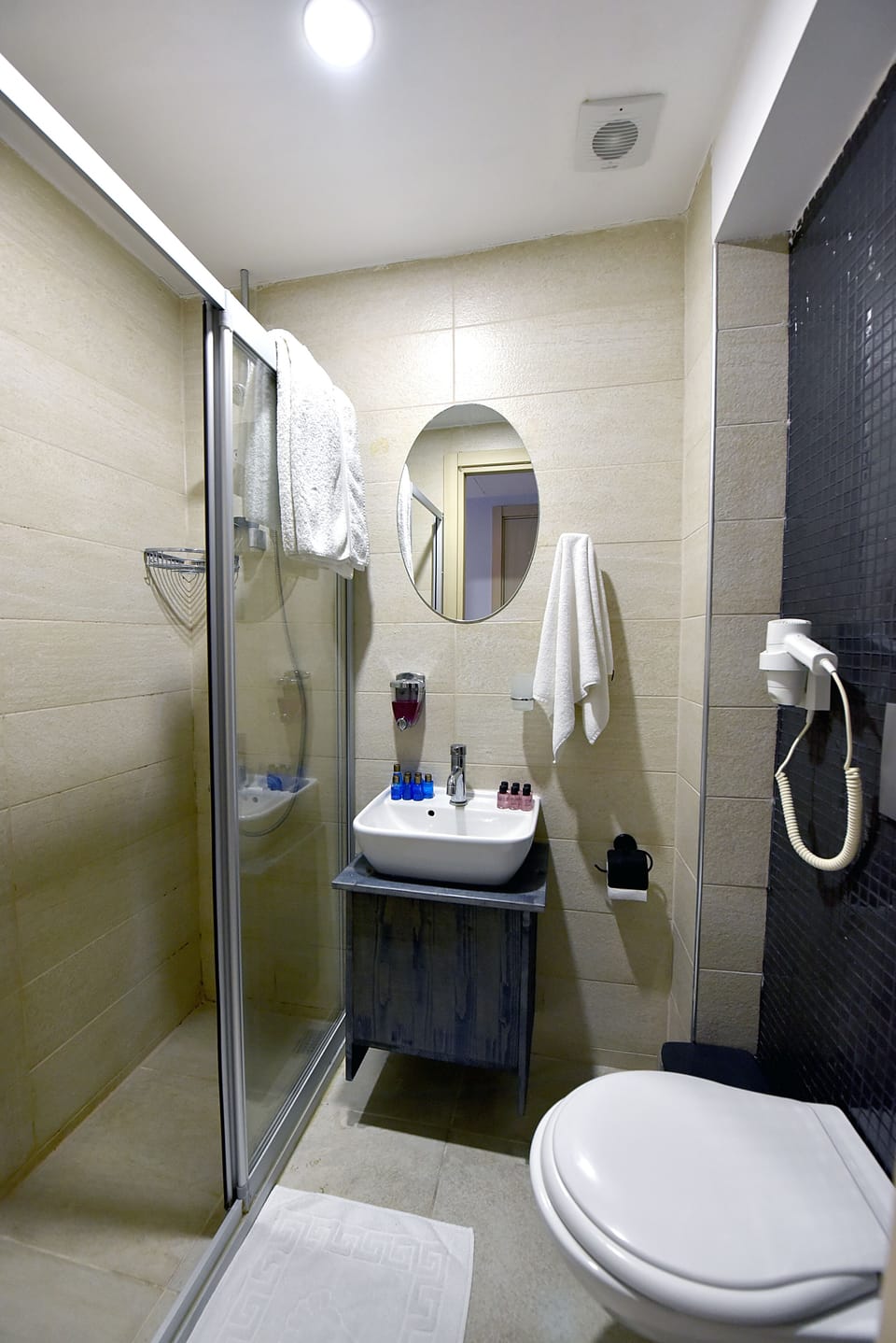 Shower, free toiletries, hair dryer, slippers