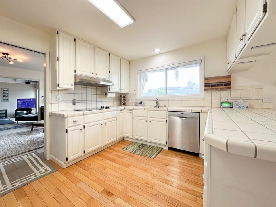 Bright kitchen w/ long counters & natural light