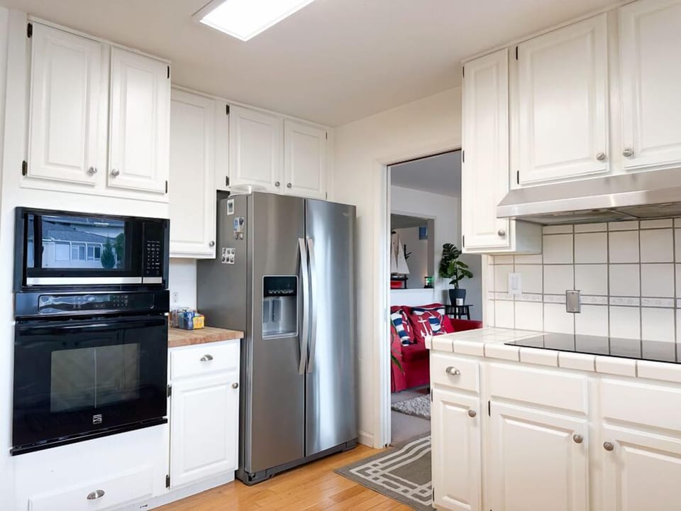Clean kitchen angle showing appliances & storage