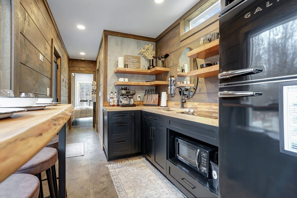 It's a small space, but we stocked this kitchen with everything needed to cook up a special meal while on vacation!