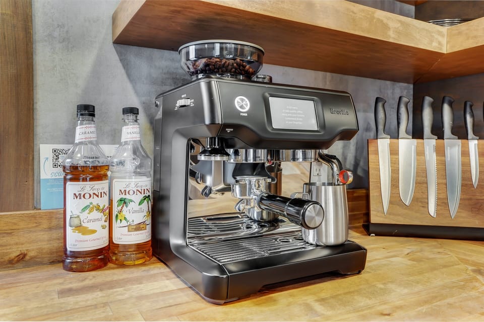 The exterior may be eye catching but this small but mighty shipping container showcases some of the best amenities inside as well! Including a Breville Coffee Maker!