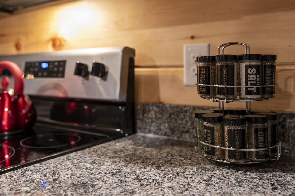 Fully equipped kitchen with granite counters and stainless appliances!