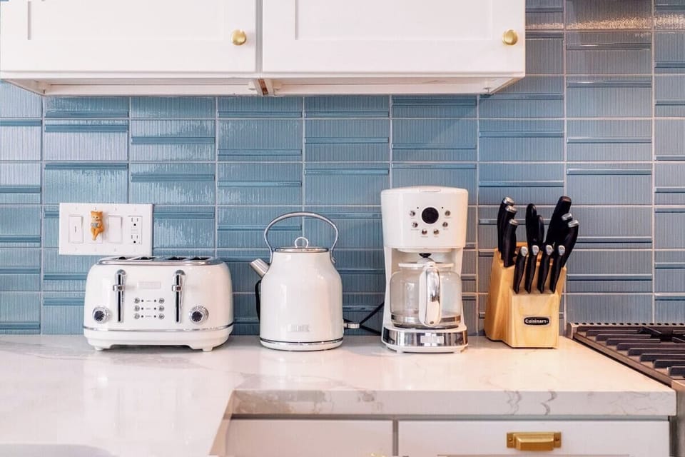Coffee/tea station: tea selections fresh coffee beans and grinder in the cabinet