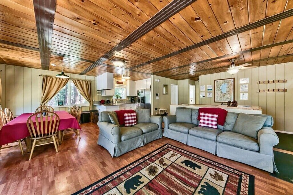 The cozy living room is an ideal space for relaxing after a long day of exploring South Tahoe. This room is equipped with a gas fireplace, comfy couches, and a large flat screen TV.