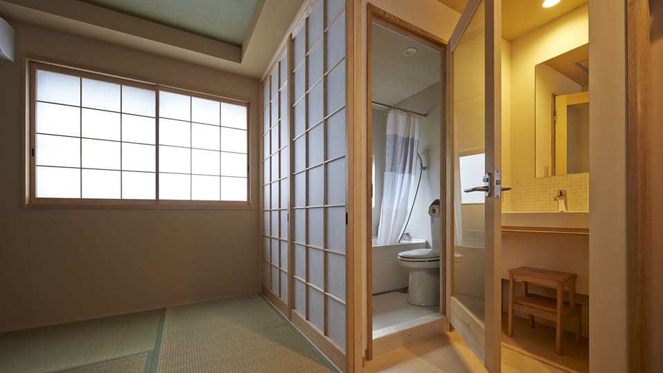 Traditional Twin with Bath | Bathroom | Hair dryer, towels, shampoo