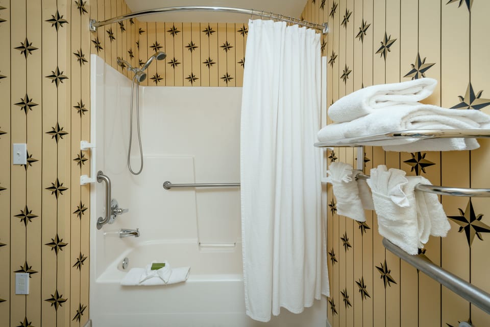 Combined shower/tub, hair dryer, towels, soap