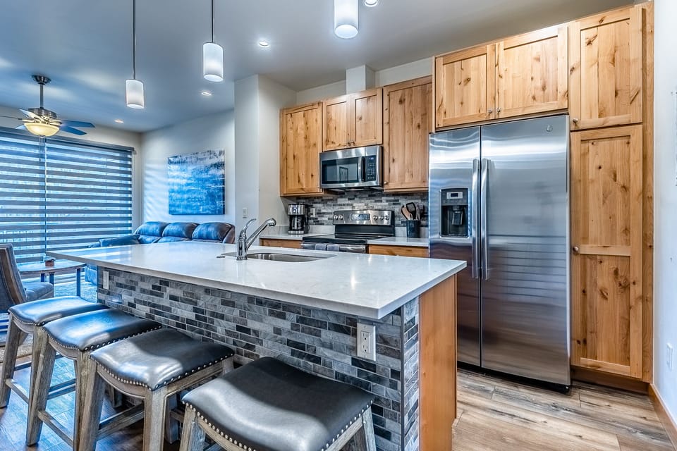 Kitchen - Large granite top kitchen island with additional seating.