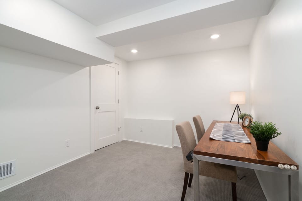 Your productive workspace awaits in this bright basement office with modern furnishings and plenty of room to spread out your work.