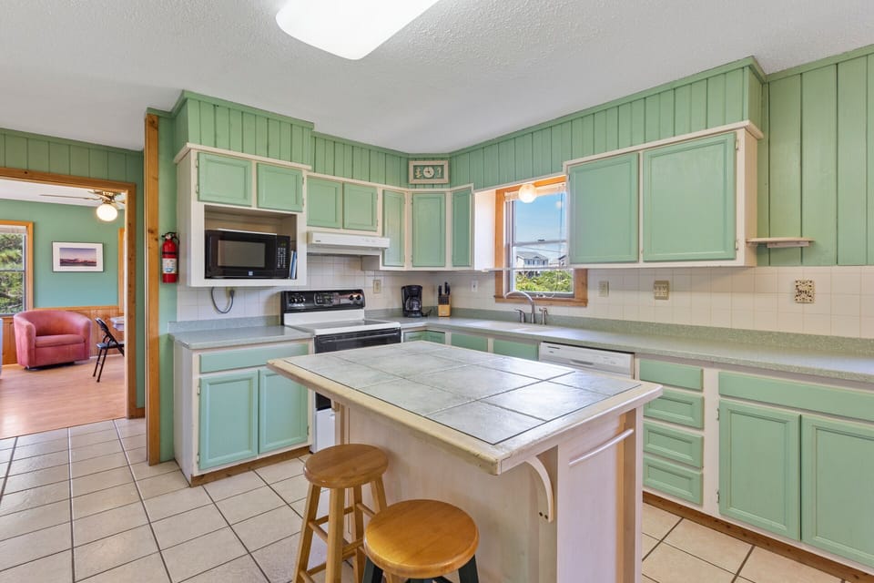 Whip up something delicious in the bright Kitchen with modern appliances and a chic, vintage feel.