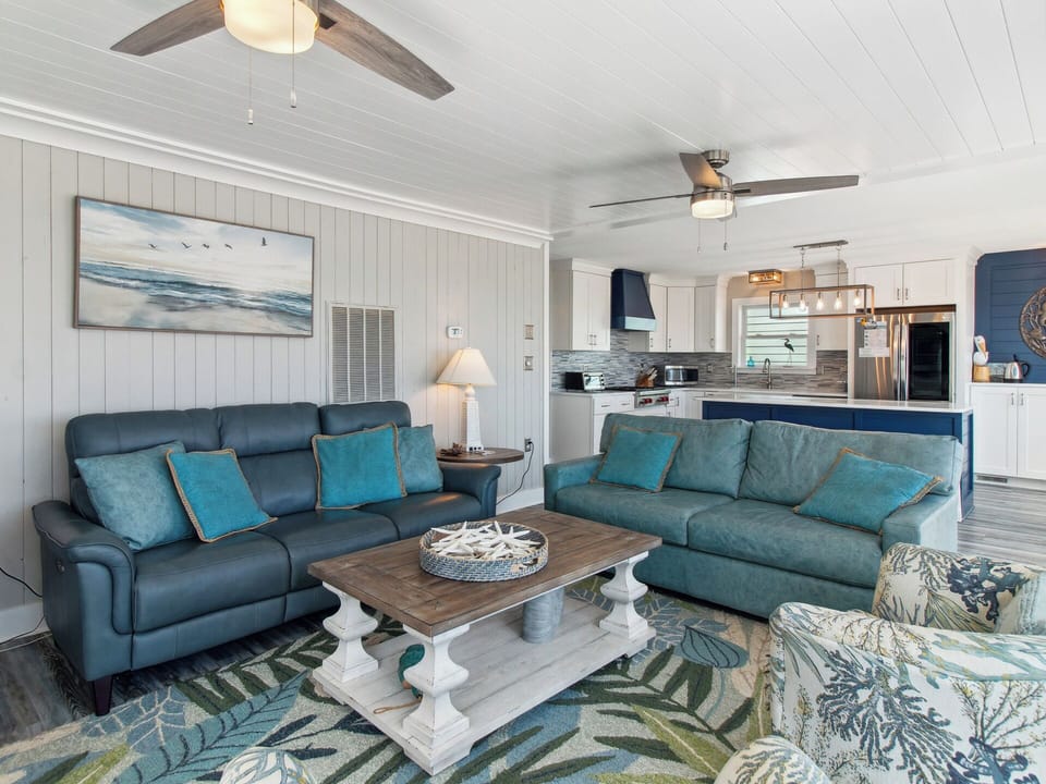 Stretch out on the comfortable furniture in the Living Area for family movie night in front of the Flat Screen TV as you enjoy the ocean views.