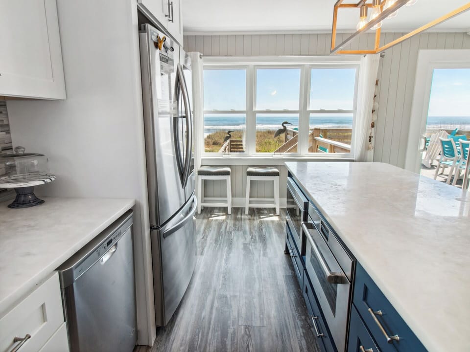 Whip up something delicious in the Gourmet Kitchen with luxurious Wolf appliances and a Convection Steam Oven that is perfect for preparing fresh, local Outer Banks seafood.