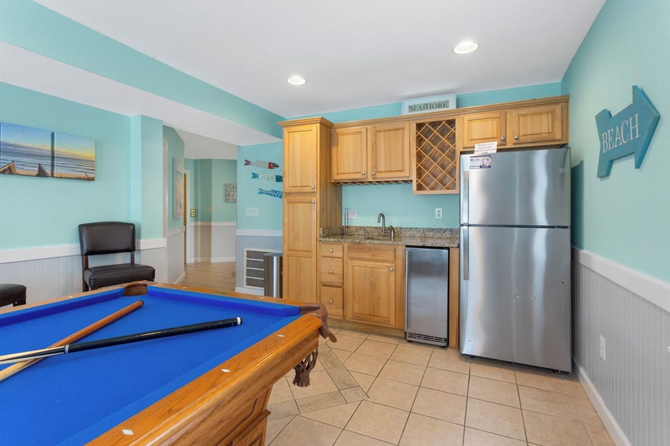 Have some fun in the Ground-Level Game Room w/Pool Table, TV, & Wet Bar!
