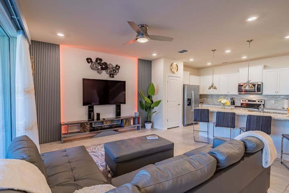 Main living area with color changing LED lights around TV.