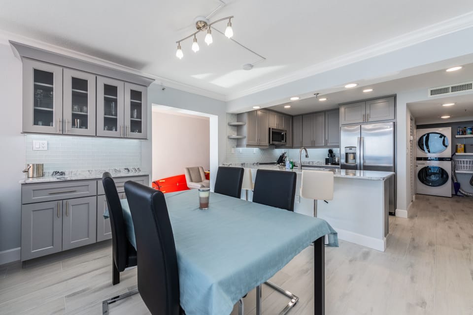 Positioned beside large windows offering ocean views during meals.