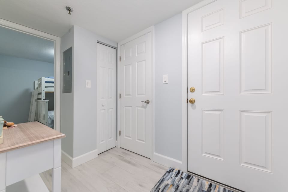 Walk-in closet with built-in drawers and shelving.