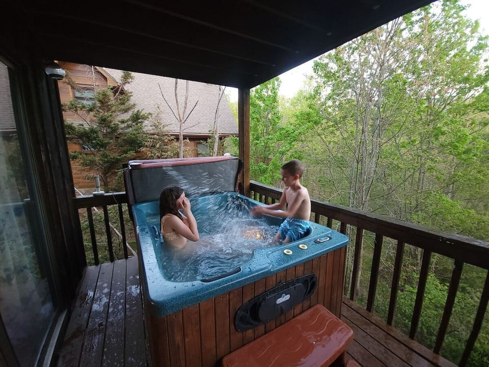 Lower deck complete with a hot tub, grill and amazing views.