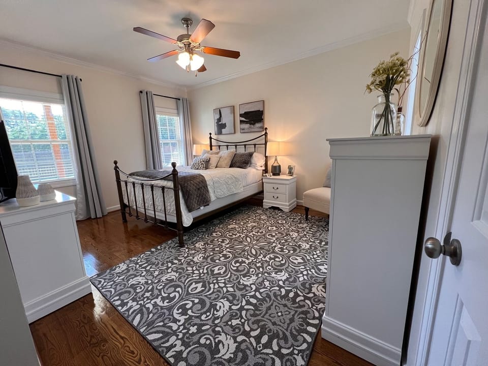 Owners suite: queen bed, TV, fan, blackout curtains, private bath, w/i closet
