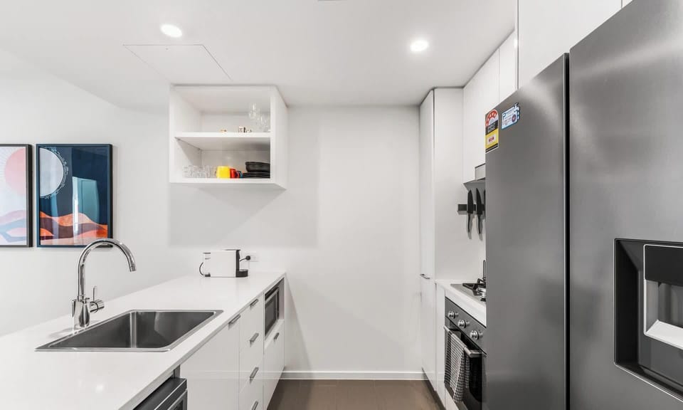Kitchen comes with side by side fridge freezer