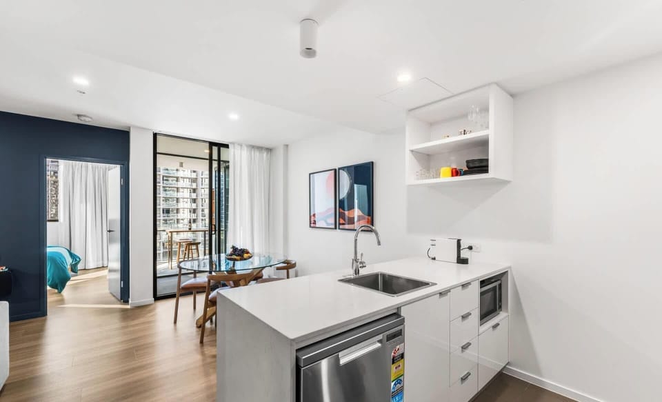 Open plan kitchen dining complete with dishwasher and microwave