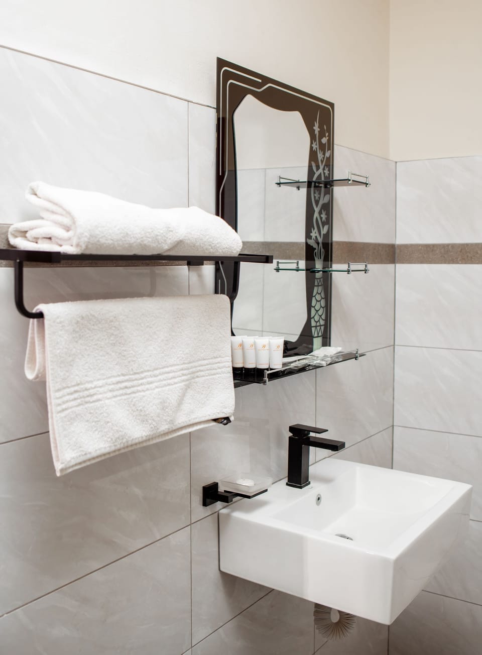 Family Room | Bathroom | Rainfall showerhead, hair dryer, towels, soap