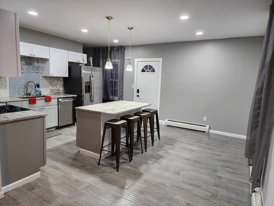 Lovely spacious kitchen to cook and enjoy your meals; Large island to sit and eat. 